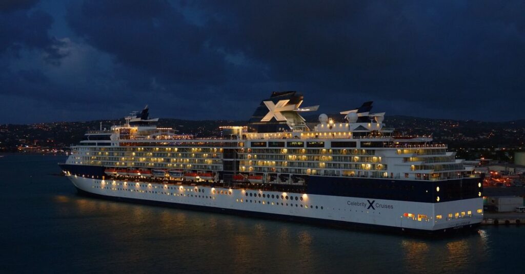 Cruise travel agent helping travelers plan a night-time cruise vacation