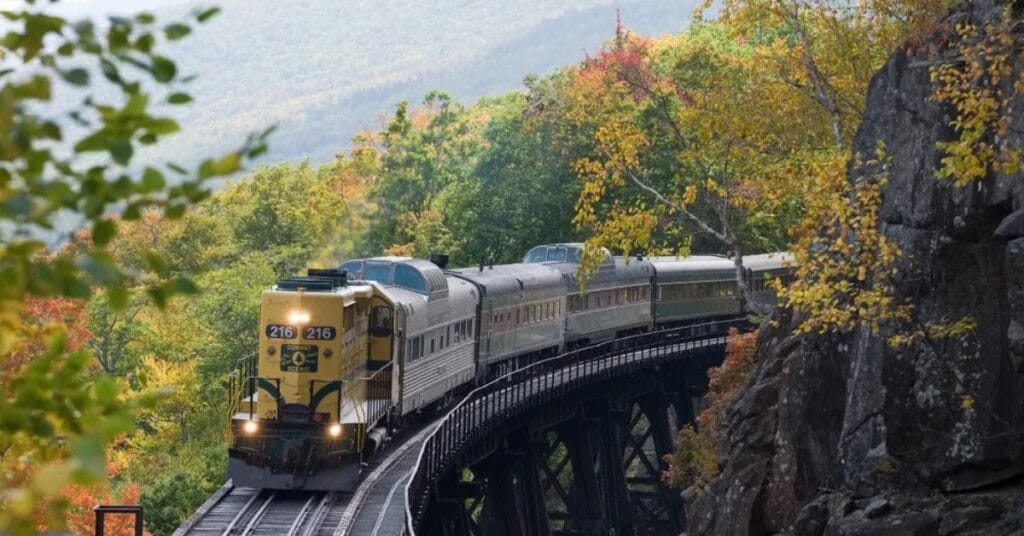 A scenic train ride through the fall foliage on a trestle bridge in North Conway, NH.