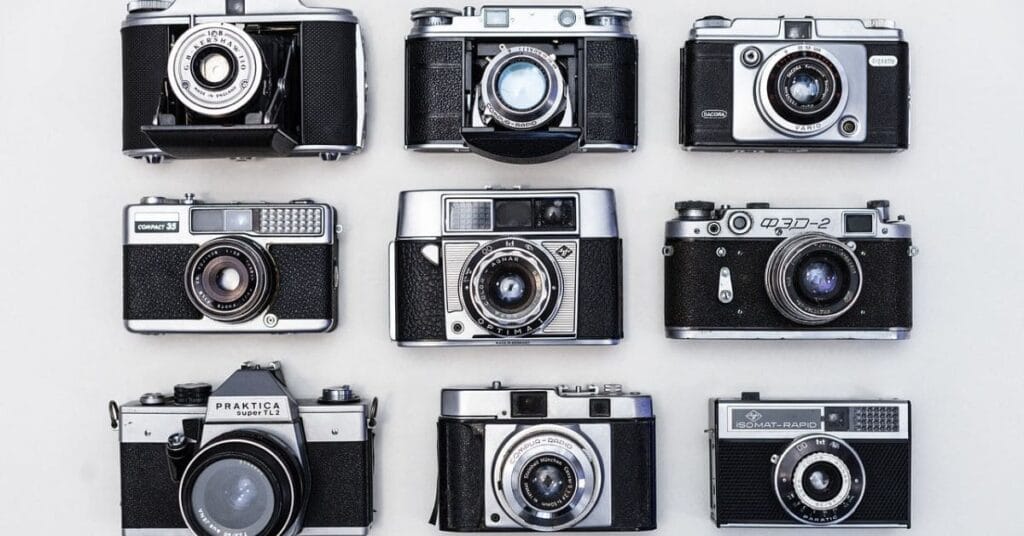 Vintage cameras displayed in a flat lay, ideal for travelers seeking the best camera for travel.