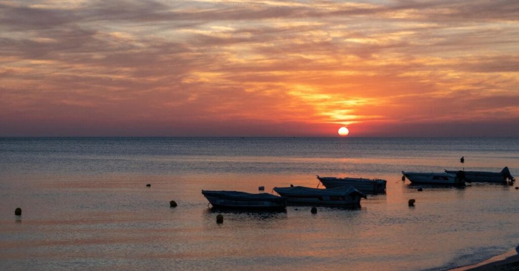 Beautiful sunset view of Orange Beach, Alabama with activities like kayaking and beach walking - things to do in Orange Beach.