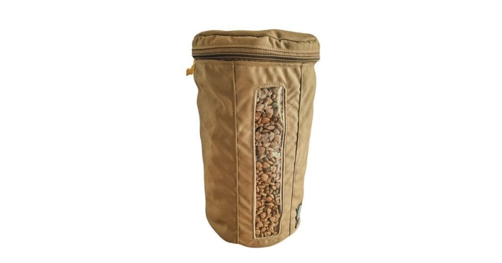 A durable, tan-colored dog food travel bag under $25 with a transparent window showing kibble inside, featuring a zippered closure for secure storage.