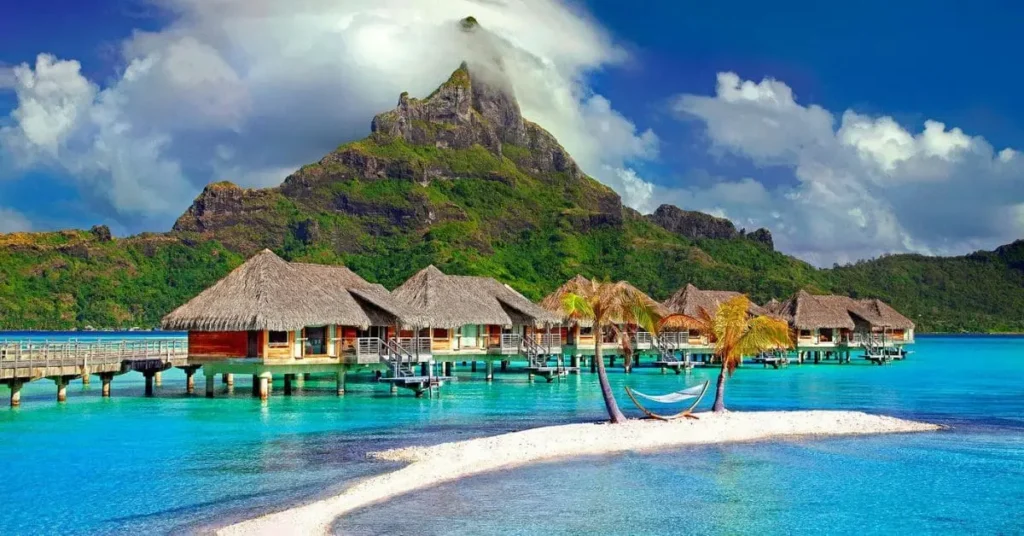 Overwater bungalows in Bora Bora: This iconic scene captures the essence of South Pacific luxury, inspiring thoughts of planning a trip. Find out the best time to visit Tahiti for a similar tropical paradise experience.