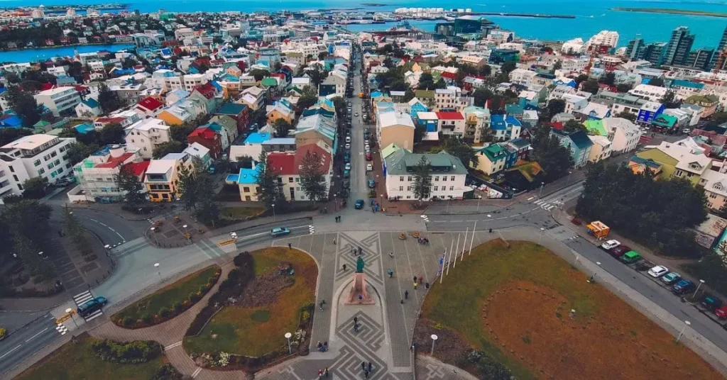 Aerial view of Reykjavik, Iceland, showcasing colorful rooftops and city streets, highlighting the best time to visit Iceland for urban exploration.